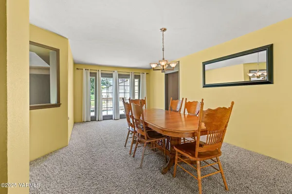 a large kitchen with stainless steel appliances granite countertop a sink and cabinets