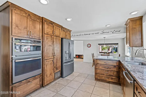 a kitchen with a stove a sink and a refrigerator