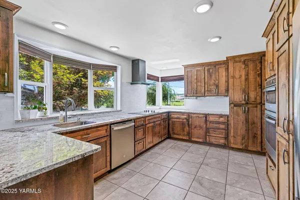 a kitchen with a table and chairs in it