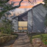 a brick house with a small yard