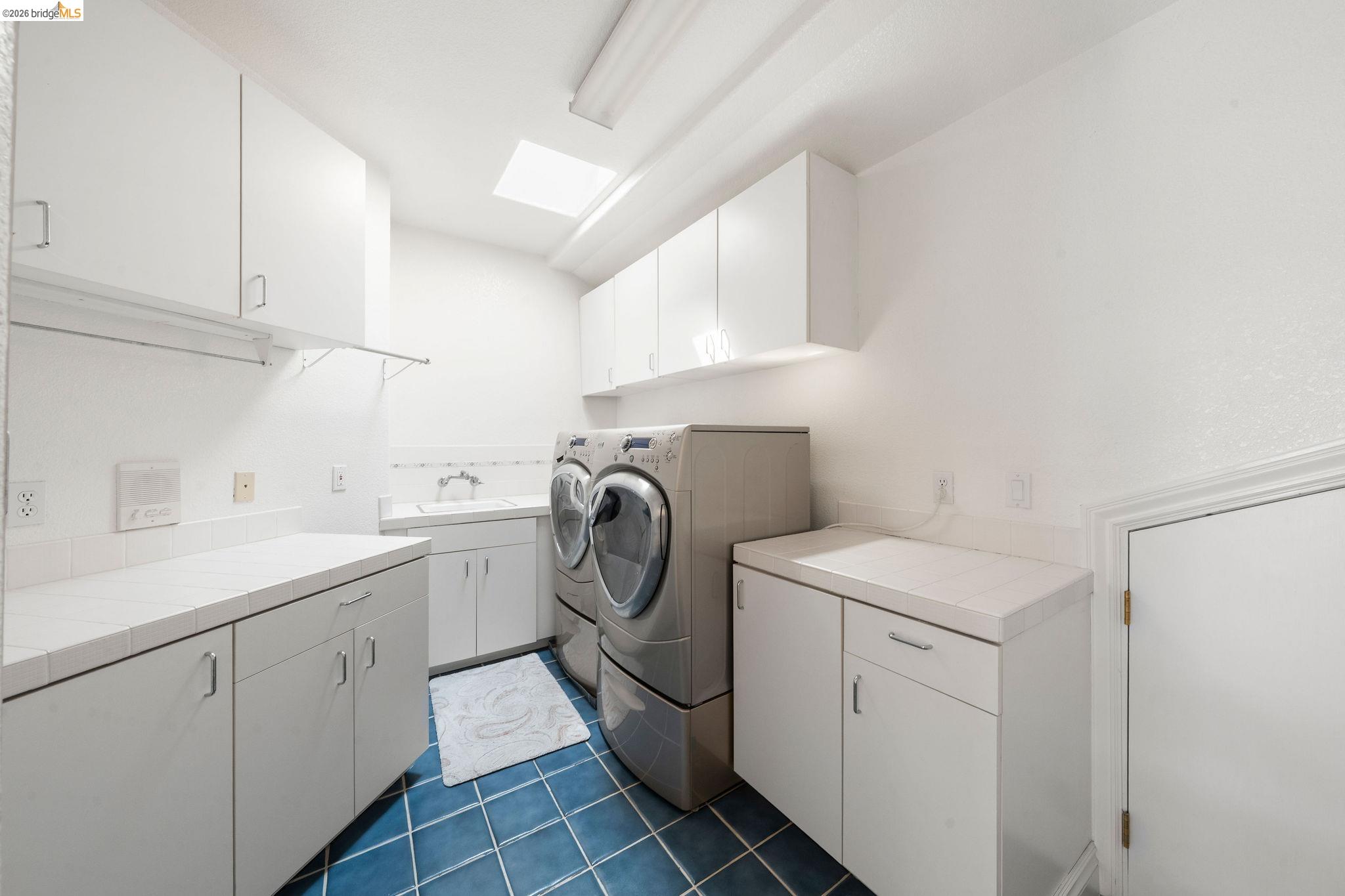 96 Shell Place Discovery Bay, CA 94505 - Photo 26 of 46 a utility room with sink dryer and washer