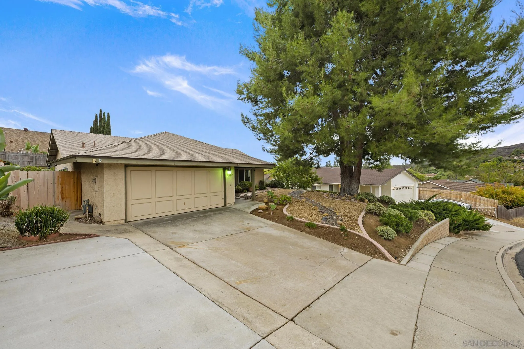 12443 McFeron Road Poway, CA 92064 - Photo 12 of 37 a view of a house with a yard and garage
