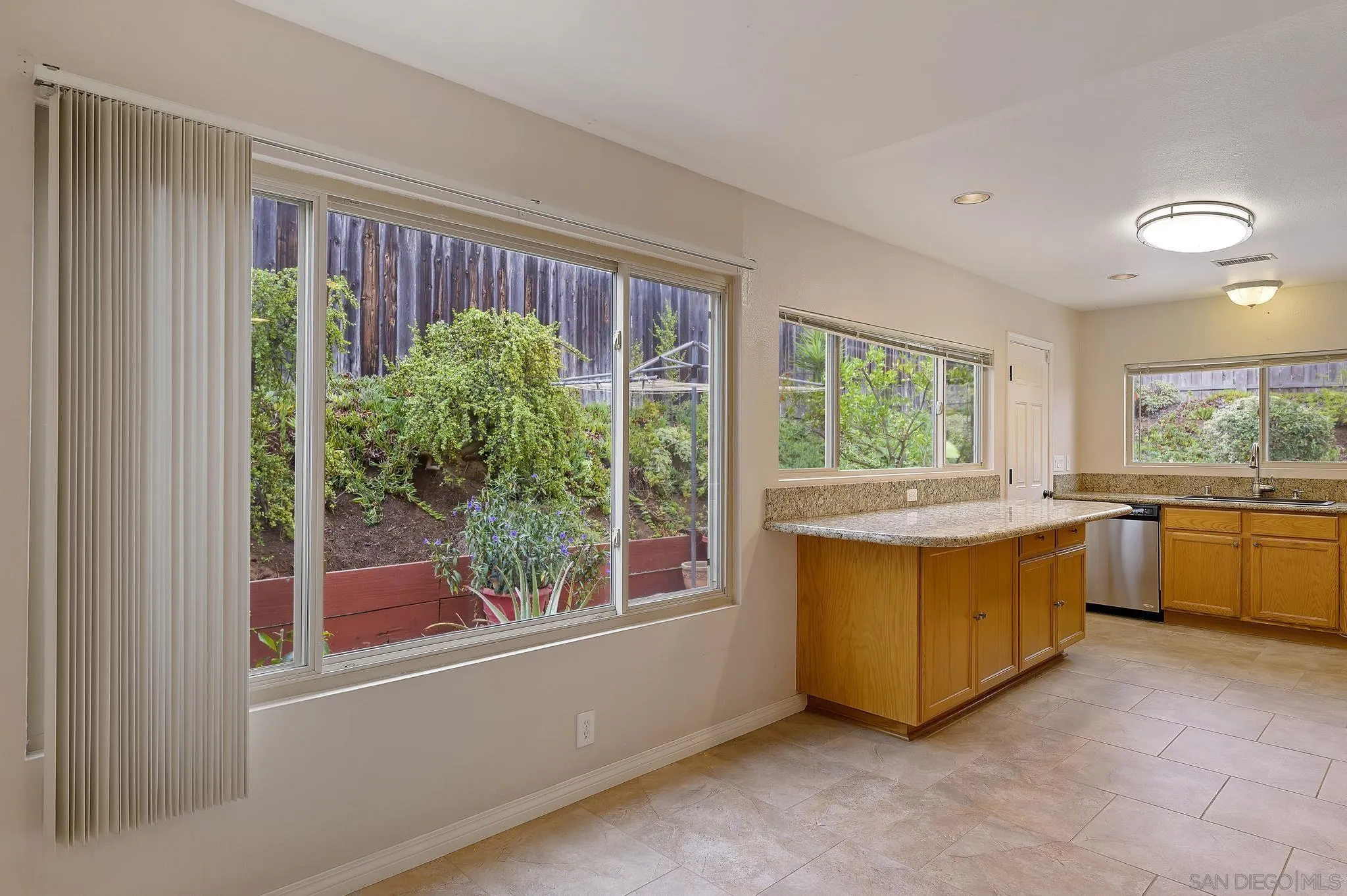 12443 McFeron Road Poway, CA 92064 - Photo 18 of 37 a kitchen with a large window and a sink