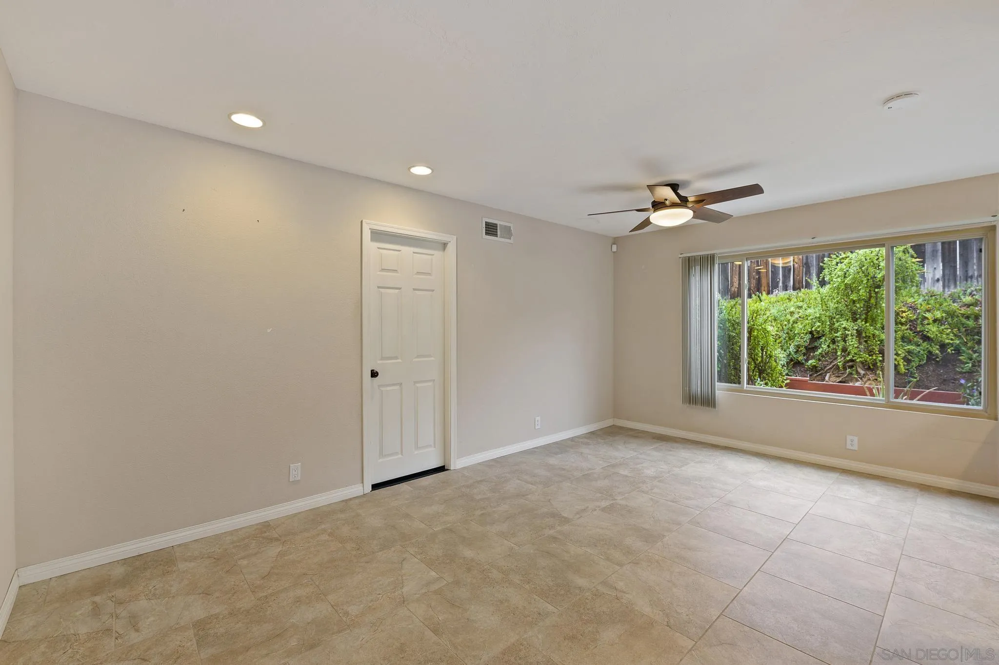 12443 McFeron Road Poway, CA 92064 - Photo 21 of 37 a view of an empty room with a window