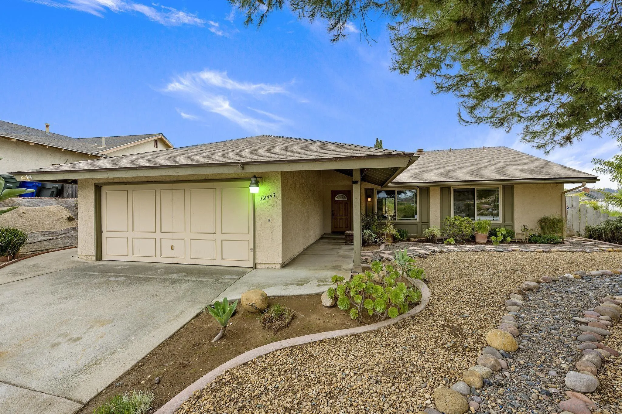 12443 McFeron Road Poway, CA 92064 - Photo 22 of 37 a front view of a house with garden