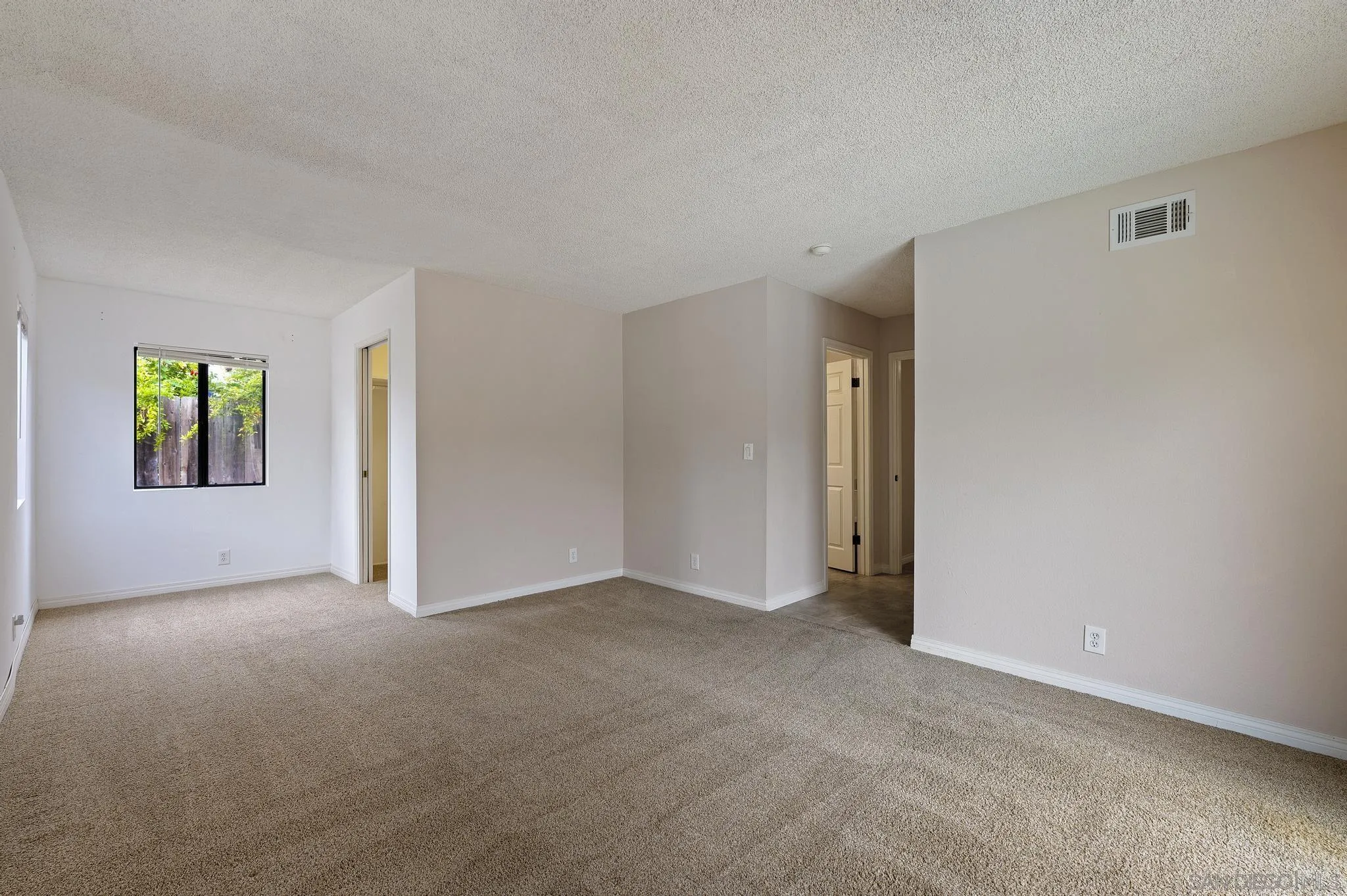 12443 McFeron Road Poway, CA 92064 - Photo 23 of 37 an empty room with windows and closet