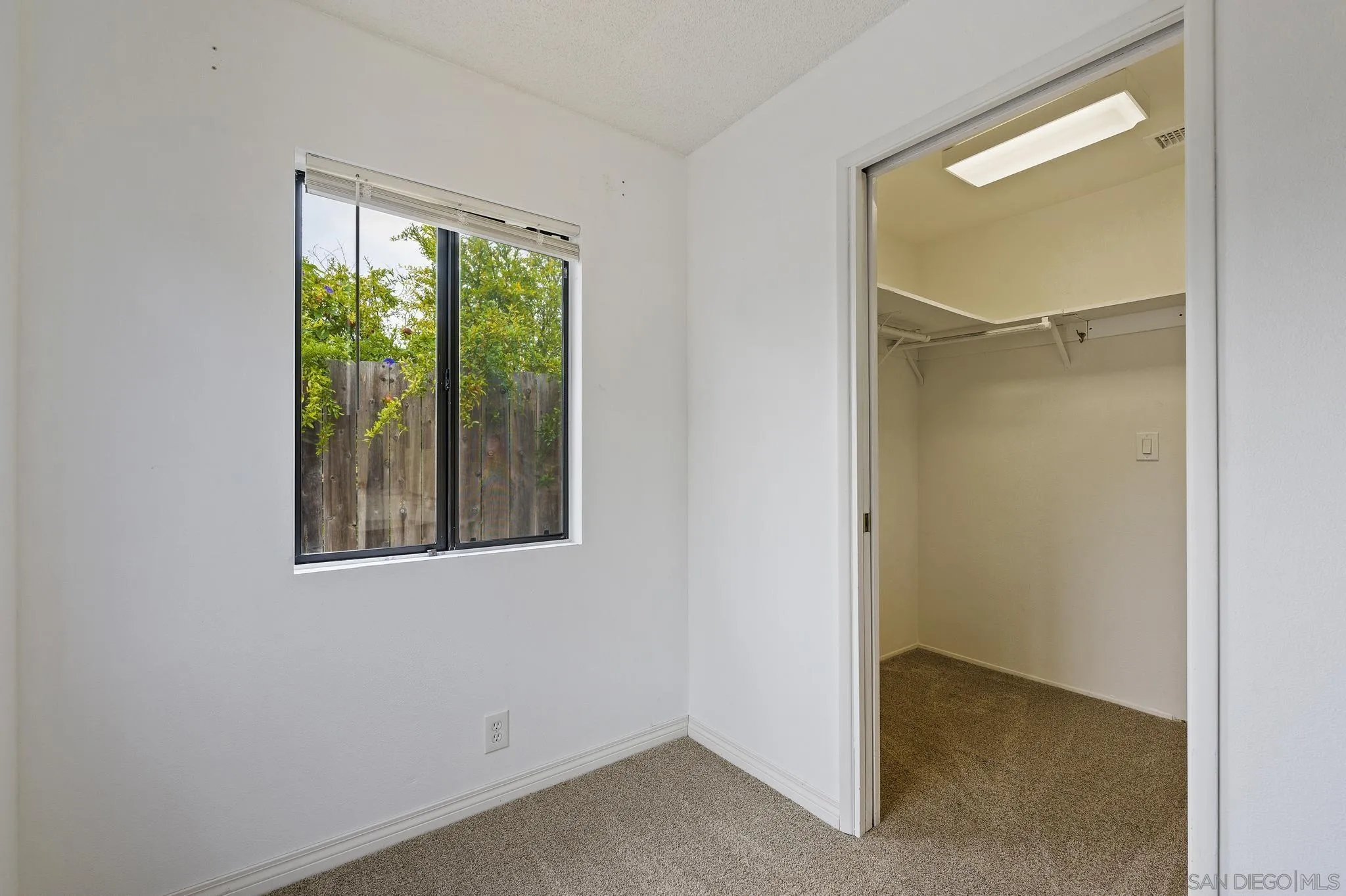 12443 McFeron Road Poway, CA 92064 - Photo 25 of 37 a view of an empty room with a window