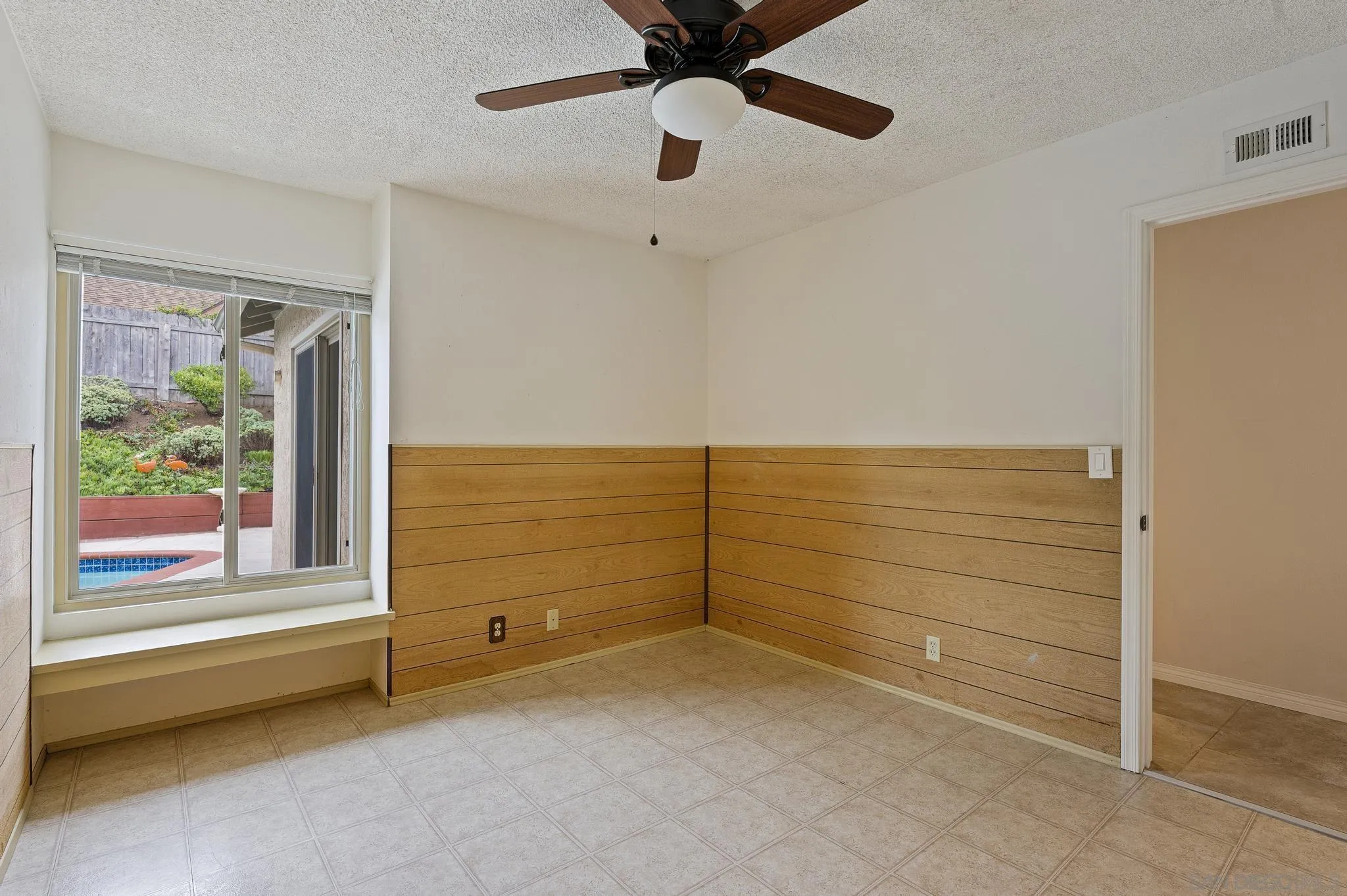 12443 McFeron Road Poway, CA 92064 - Photo 32 of 37 a view of an empty room with a window