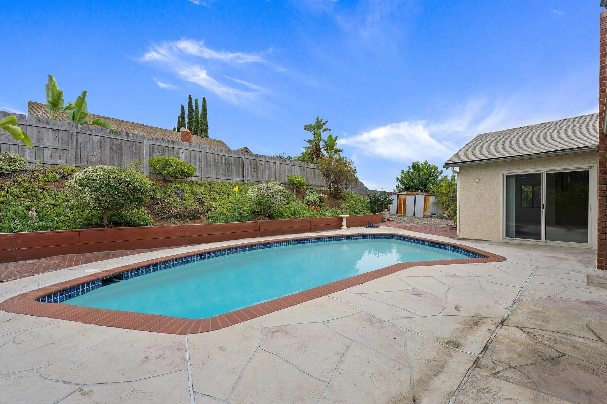 12443 McFeron Road Poway, CA 92064 - Photo 33 of 37 a view of a swimming pool and a yard