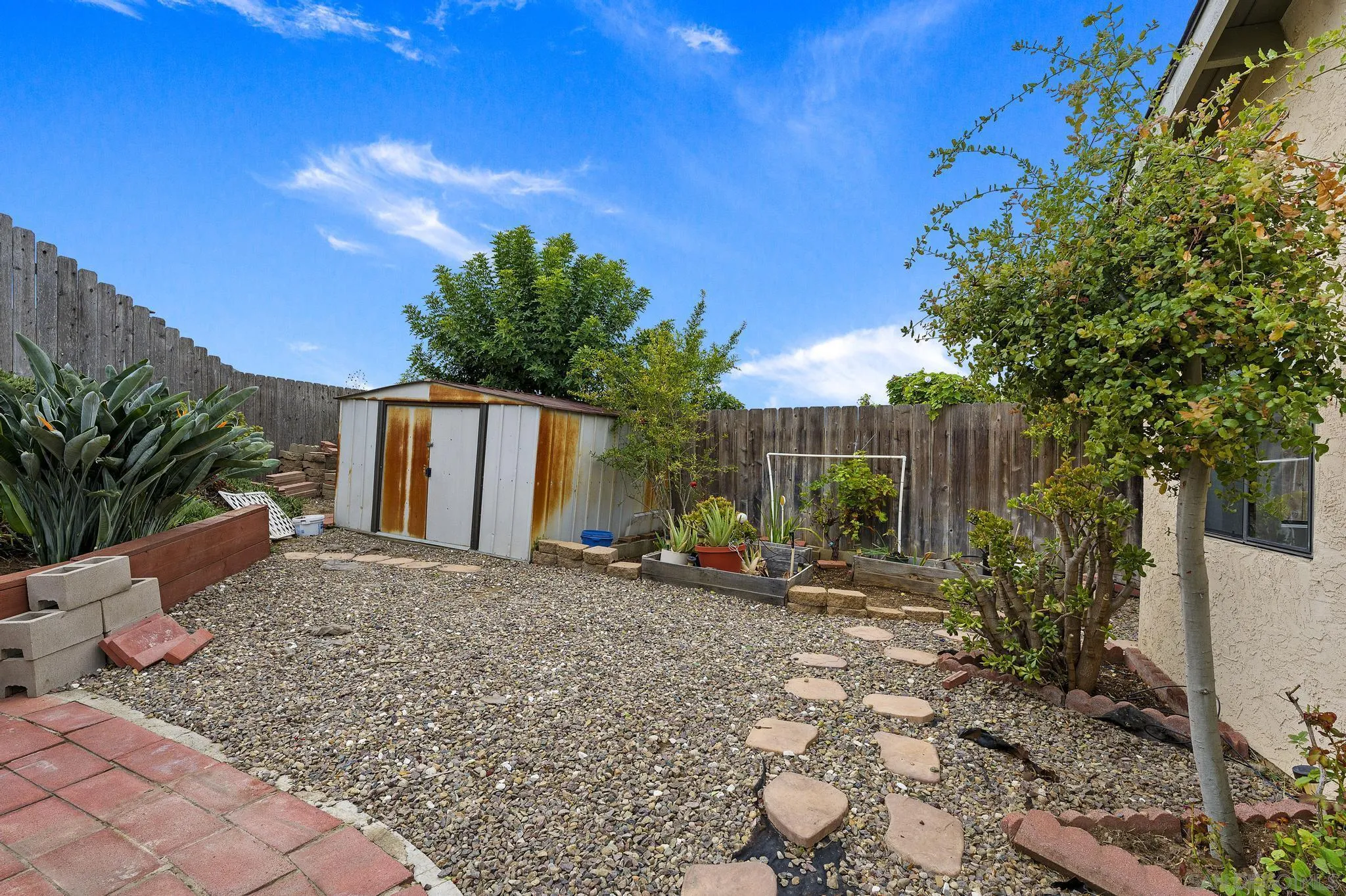 12443 McFeron Road Poway, CA 92064 - Photo 36 of 37 a view of a house with backyard and sitting area