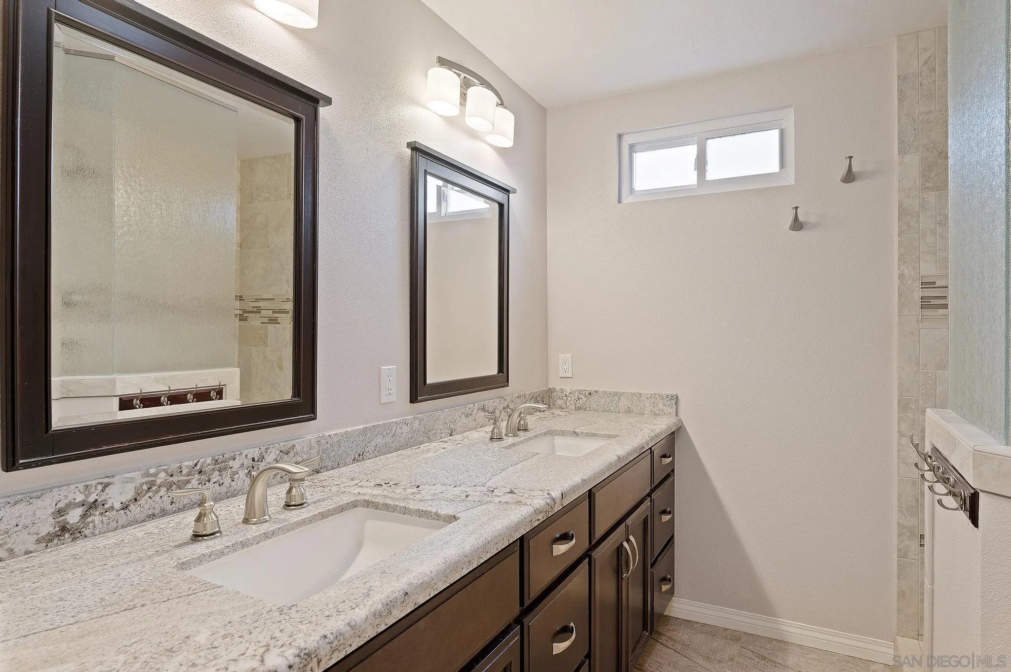 12443 McFeron Road Poway, CA 92064 - Photo 4 of 37 a bathroom with a granite countertop sink and a mirror