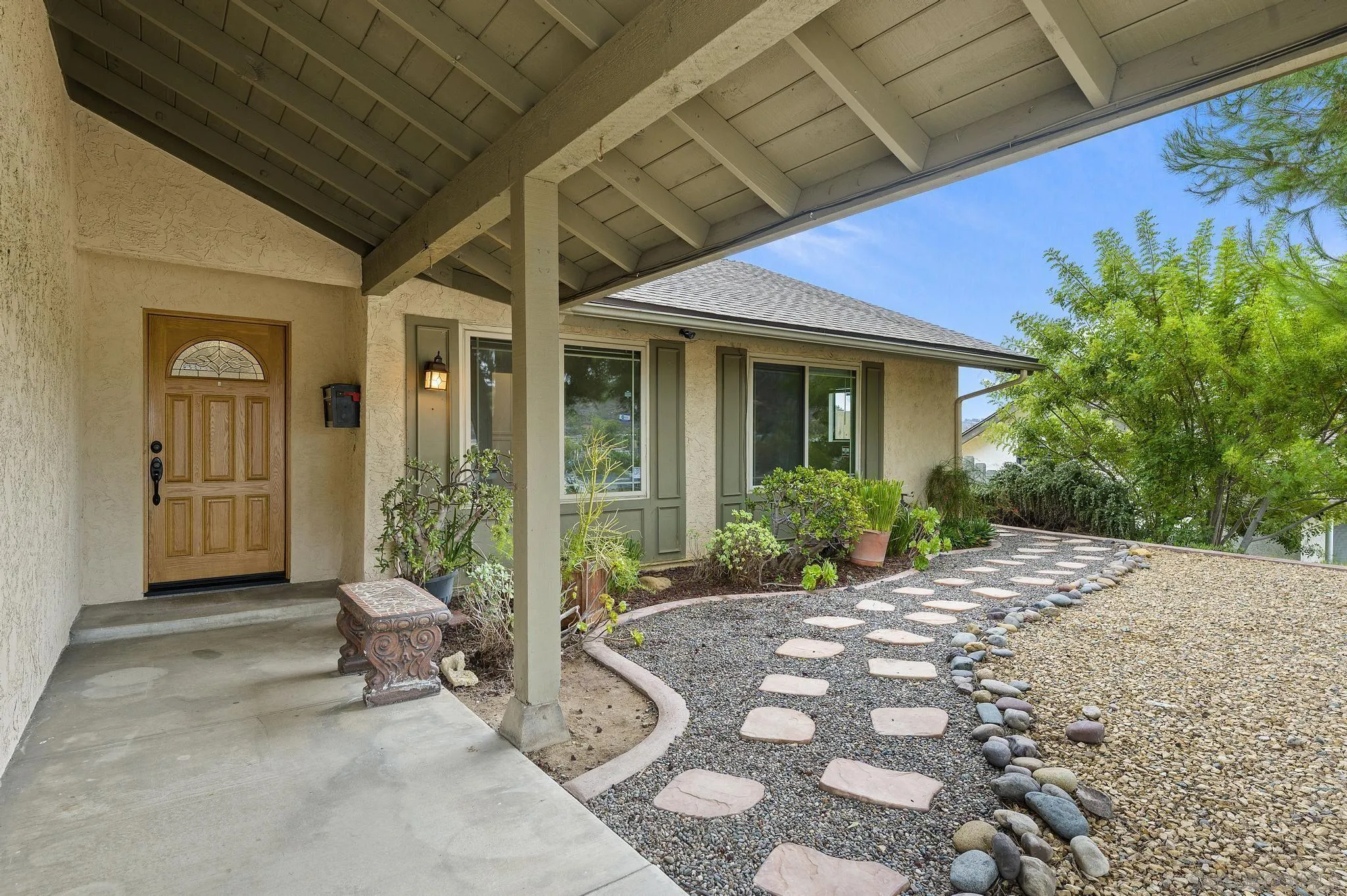 12443 McFeron Road Poway, CA 92064 - Photo 7 of 37 a view of a patio with table and chairs and potted plants