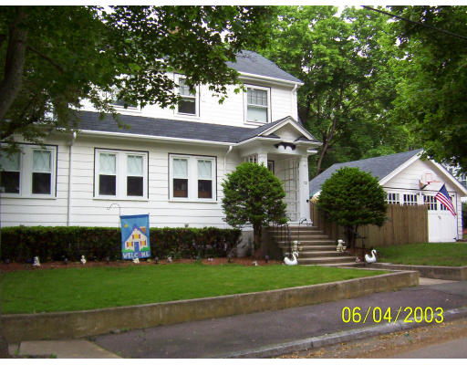 72 Ashcroft Road Medford, MA 02155 - Photo 1 of 1 a front view of a house with a garden