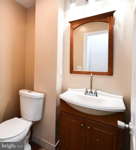 a view of a patio with couches table and chairs and potted plants