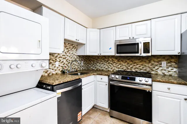 a kitchen with a stove and a microwave