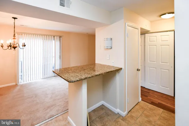 a view of a kitchen cabinets and wooden floor