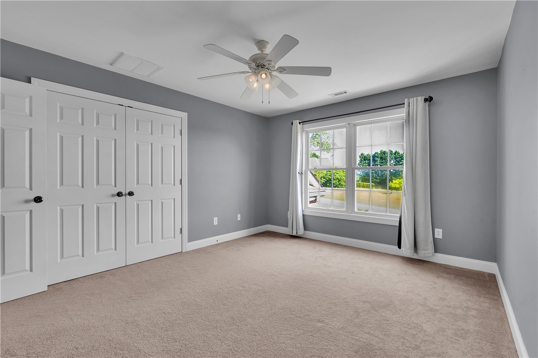 406 Hopewell Ridge Anderson, SC 29621 - Photo 27 of 46 This spacious bedroom offers ample natural light and a comfortable, inviting atmosphere.