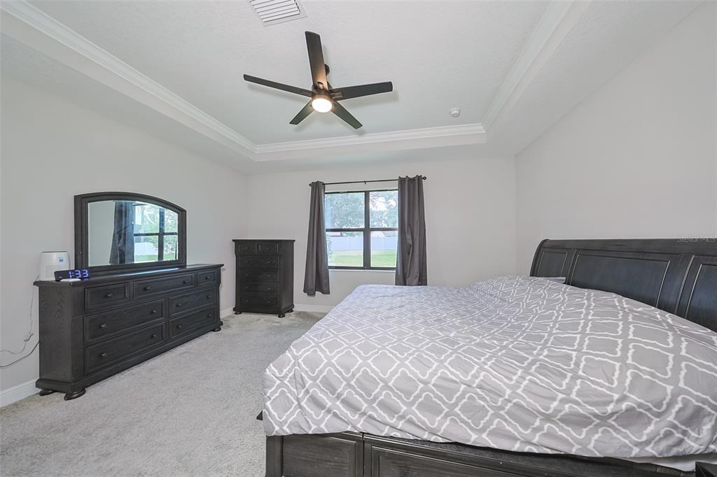 130 Azul Drive Seffner, FL 33584 - Photo 21 of 47 a bedroom with a bed and window