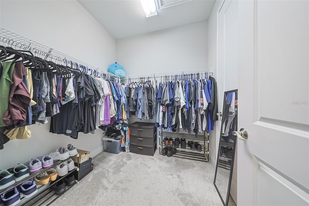 130 Azul Drive Seffner, FL 33584 - Photo 24 of 47 a view of walk in closet with clothes