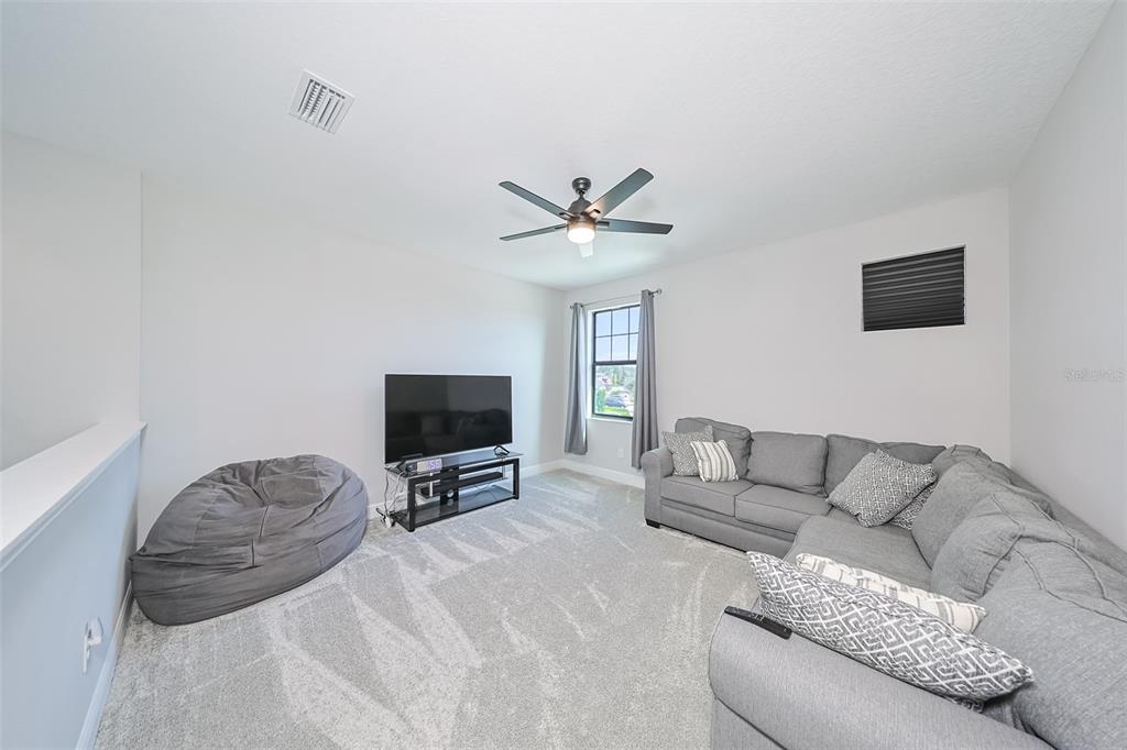 130 Azul Drive Seffner, FL 33584 - Photo 26 of 47 a living room with furniture and a flat screen tv