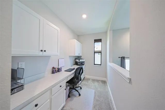 a spacious bathroom with a granite countertop sink a toilet and a mirror
