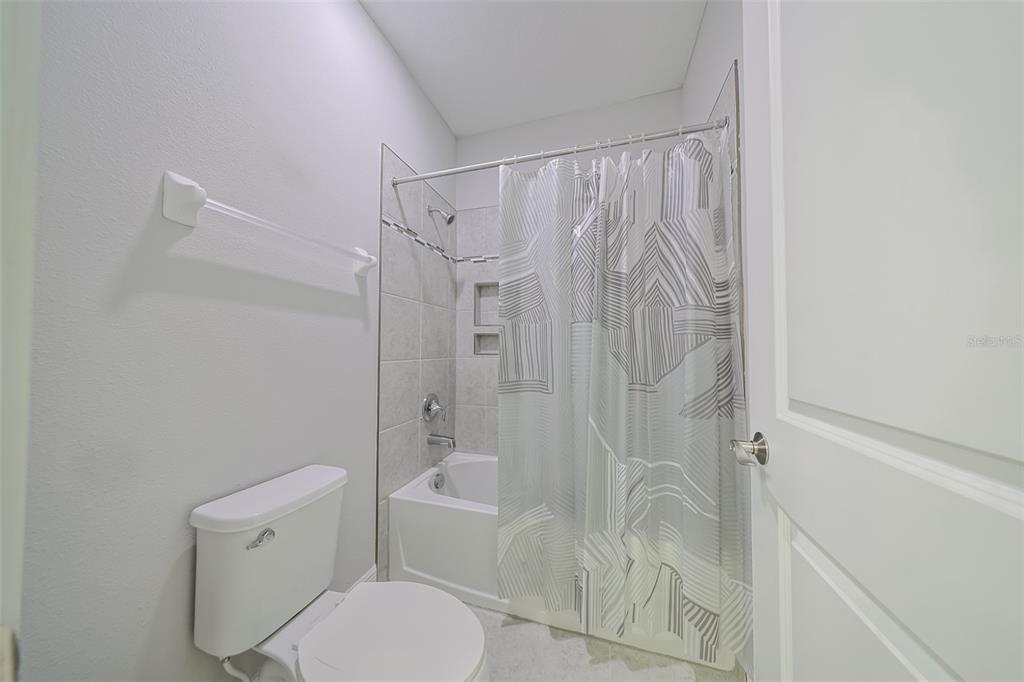 130 Azul Drive Seffner, FL 33584 - Photo 30 of 47 a bathroom with a toilet and shower