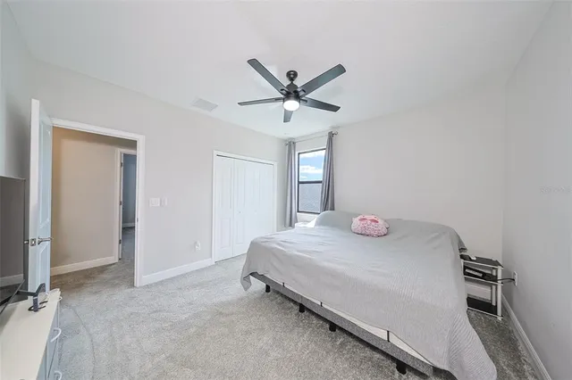 a room with a bed and a chandelier