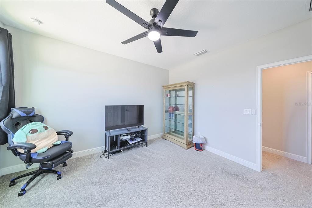 130 Azul Drive Seffner, FL 33584 - Photo 38 of 47 a living room with furniture and a flat screen tv