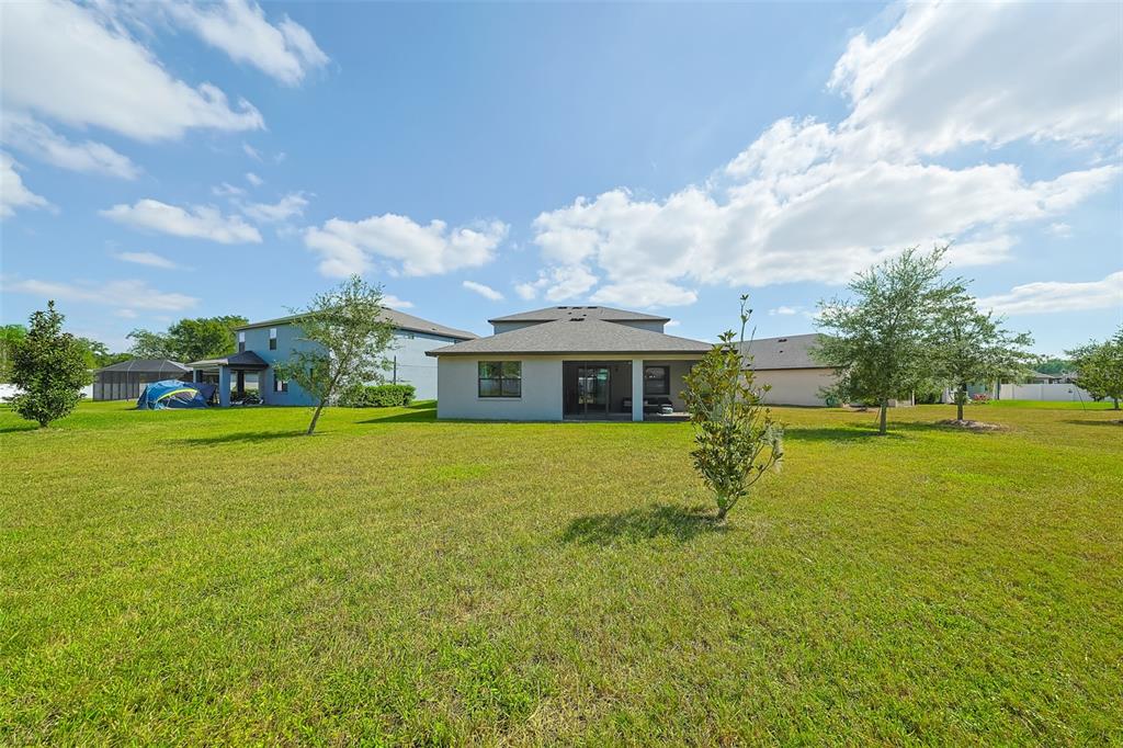 130 Azul Drive Seffner, FL 33584 - Photo 43 of 47 a front view of house with yard and lake