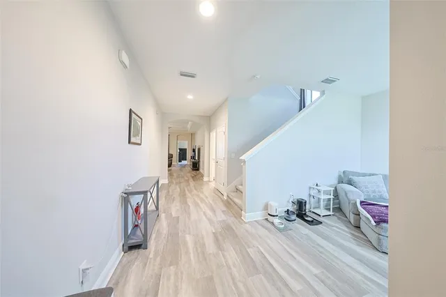 a view of a living room with wooden floor
