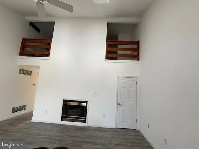 a view of a livingroom with wooden floor