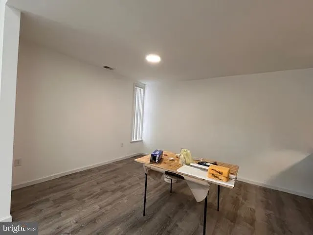 a room with a table and chairs