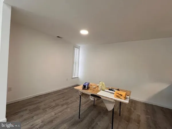 a room with a table and chairs