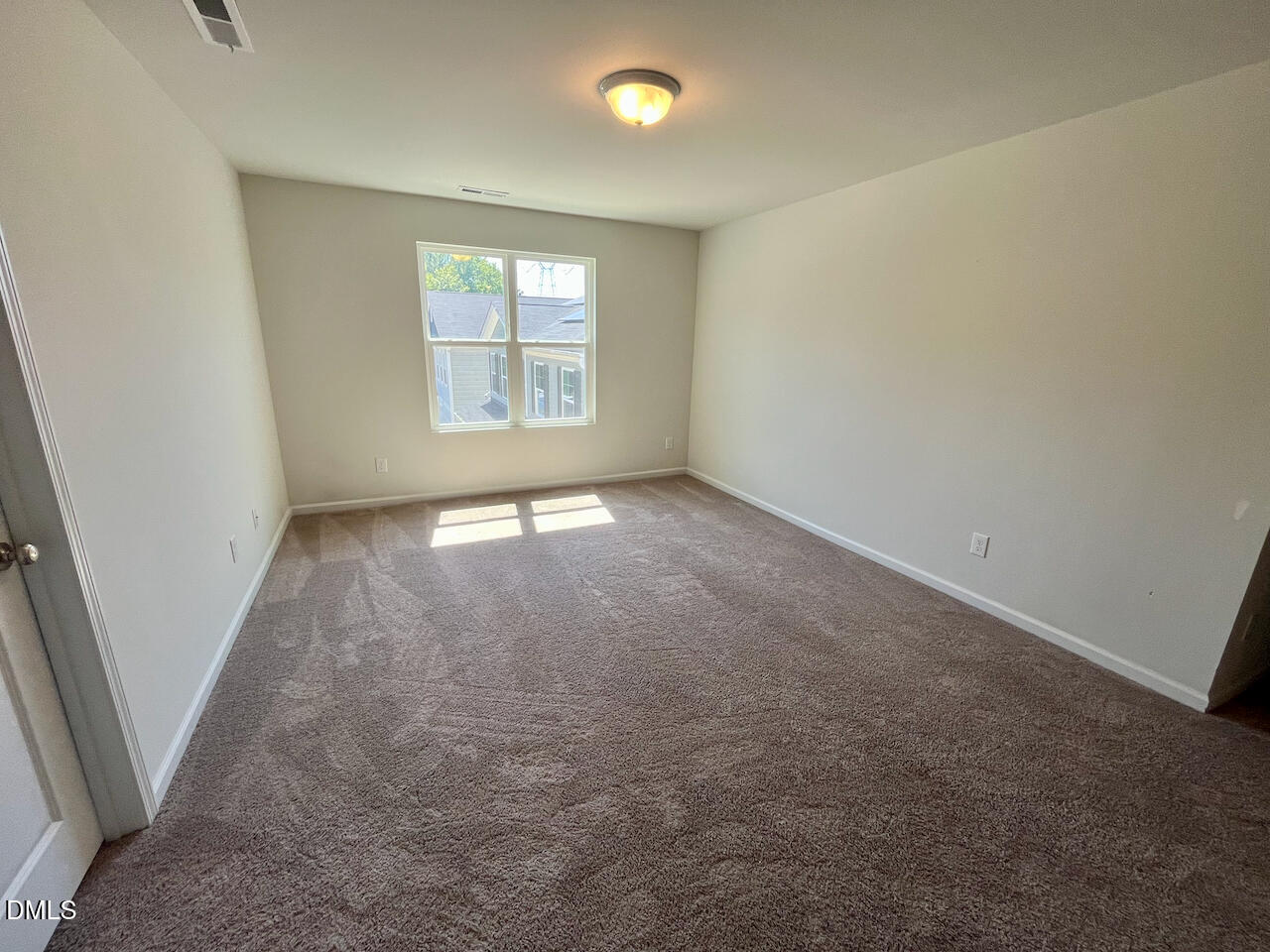 924 Peninsula Place Knightdale, NC 27545 - Photo 13 of 22 an empty room with windows