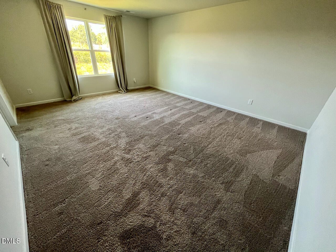 924 Peninsula Place Knightdale, NC 27545 - Photo 16 of 22 an empty room with windows