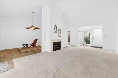 a view of a livingroom with furniture and a fireplace