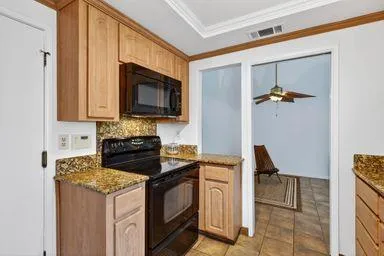 a kitchen with a stove and a microwave