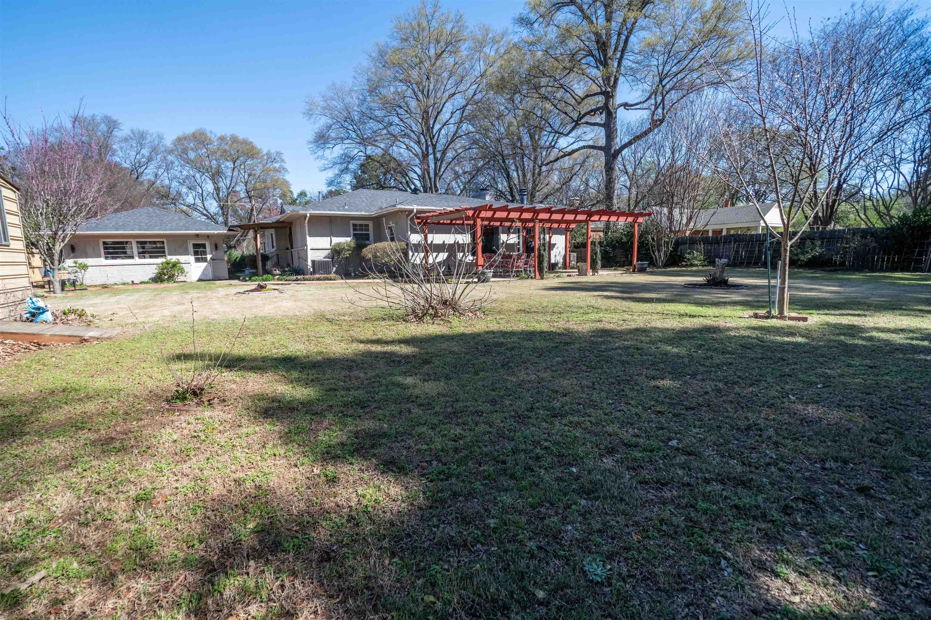 5099 Walnut Grove Road Memphis, TN 38117 - Photo 22 of 24 Fenced yard with a pergola