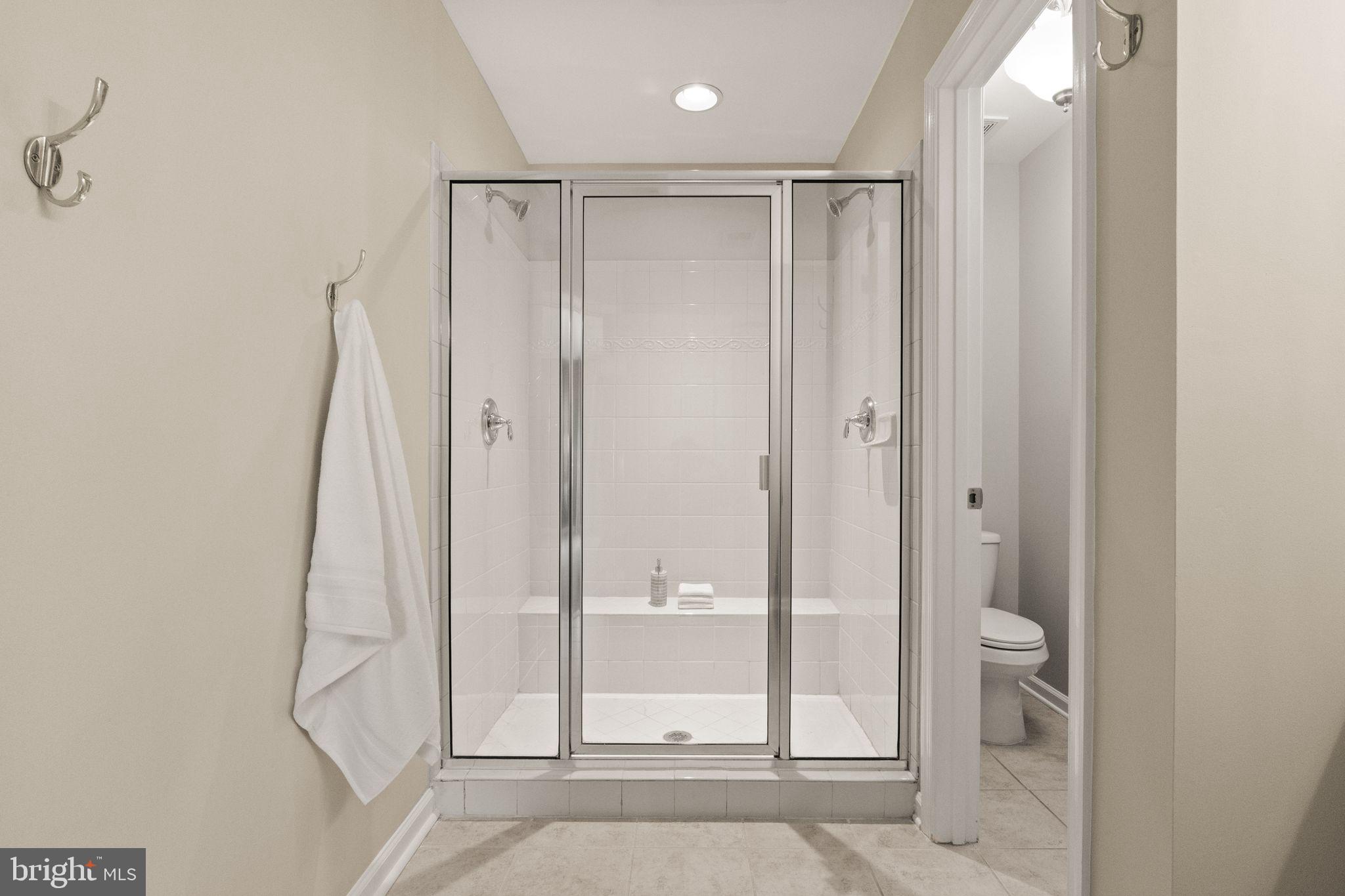 7015 Trek Way Gainesville, VA 20155 - Photo 27 of 56 Walk-in shower with bench and private water closet