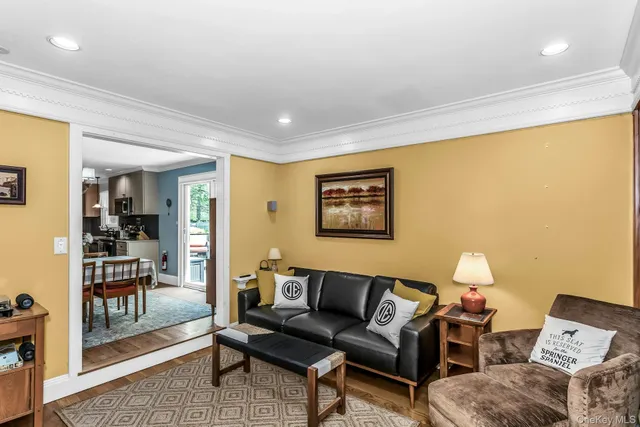 a living room with furniture and a lamp