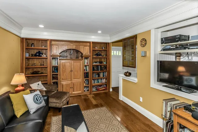 a living room with a couch and a flat screen tv