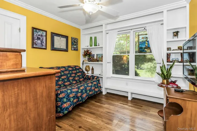 a bedroom with furniture and a window