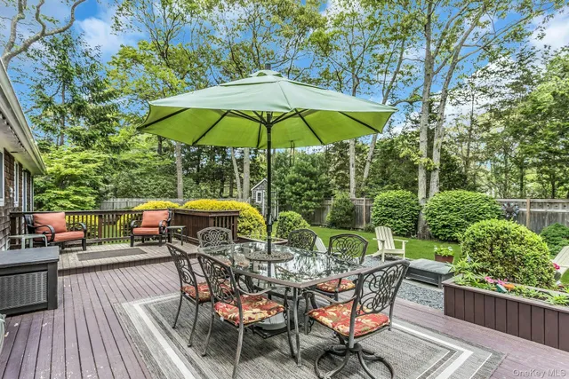 an outdoor space with furniture and umbrella