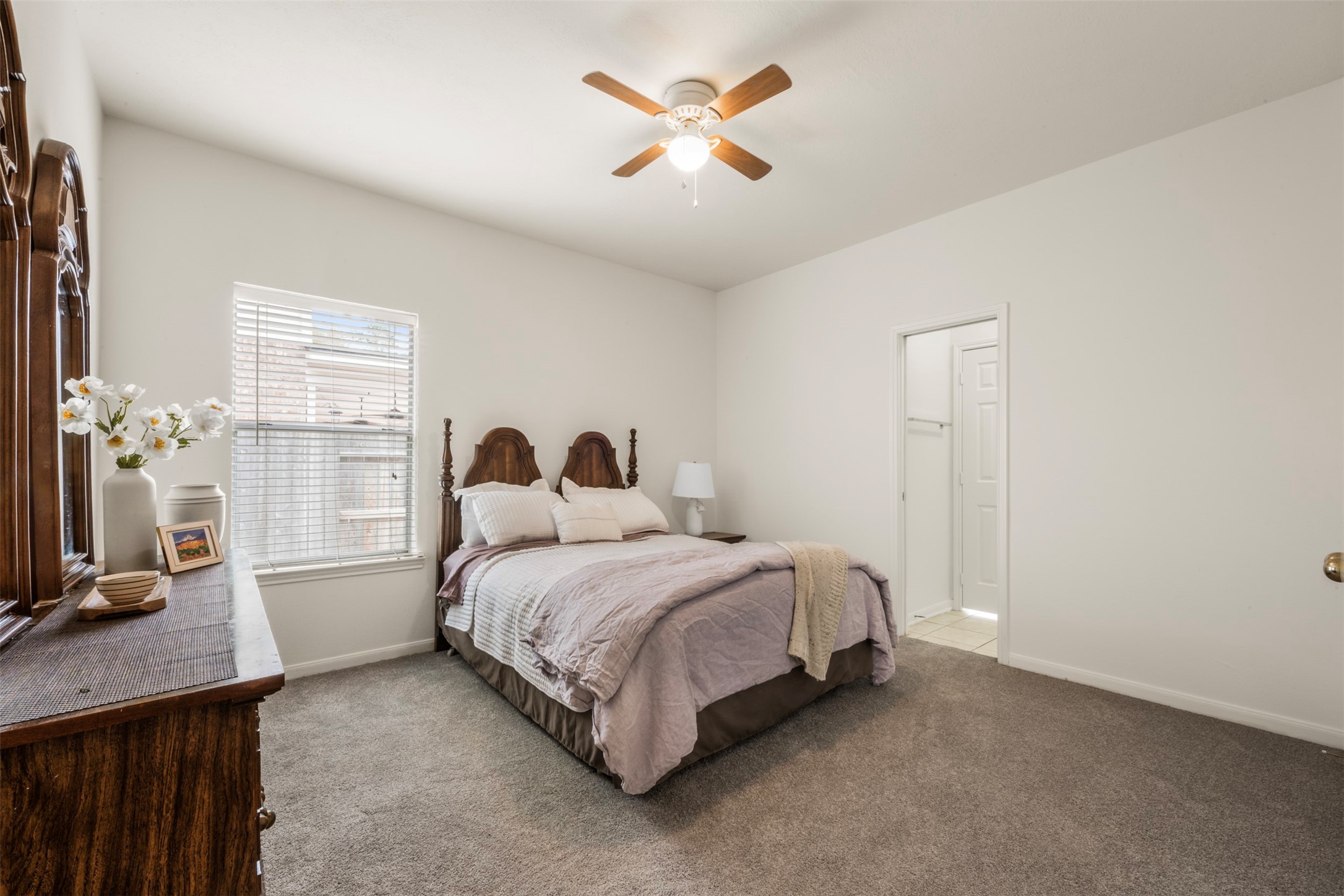 9211 Memorial Hills Drive Spring, TX 77379 - Photo 9 of 33 Enjoy this primary bedroom, with ceiling fan and new carpet.