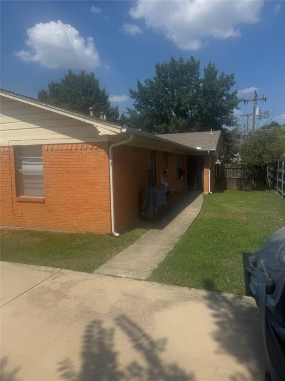 220 West Union Bower Road, Unit 220 222 Irving, TX 75061 - Photo 3 of 4 a front view of a house with a yard and garage