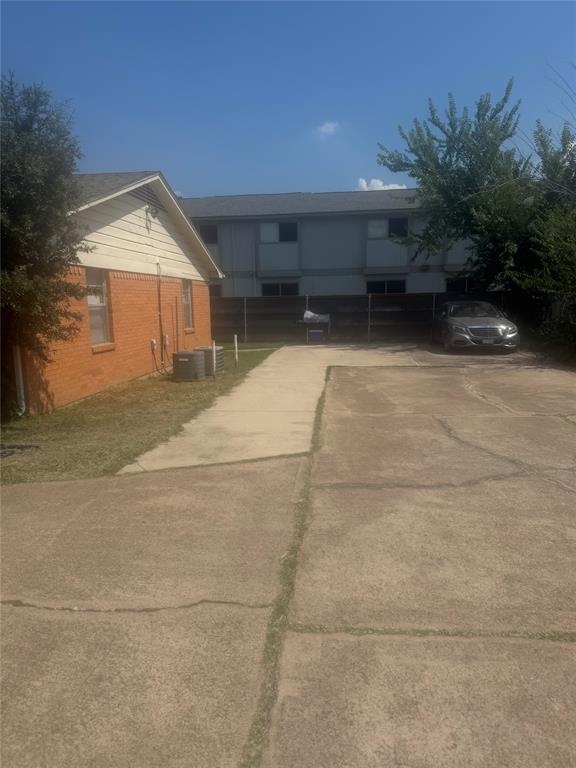 220 West Union Bower Road, Unit 220 222 Irving, TX 75061 - Photo 4 of 4 a backyard of a house with plants and trees
