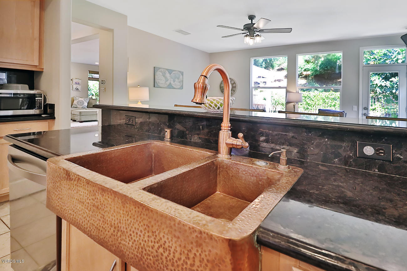 143 Brooks Road Simi Valley, CA 93065 - Photo 12 of 42 a kitchen with a stove a sink and a granite counter tops