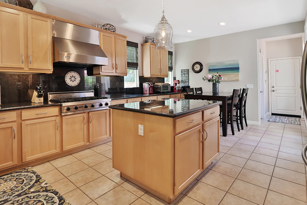 143 Brooks Road Simi Valley, CA 93065 - Photo 13 of 42 a kitchen with stainless steel appliances granite countertop a stove a sink and a microwave