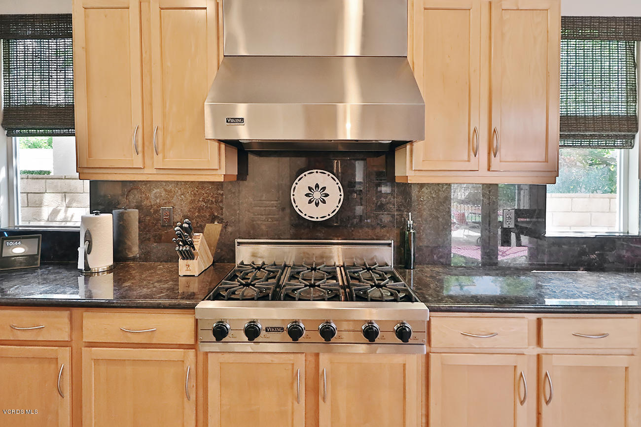 143 Brooks Road Simi Valley, CA 93065 - Photo 14 of 42 a kitchen with granite countertop a stove and a sink