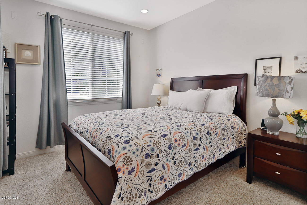 143 Brooks Road Simi Valley, CA 93065 - Photo 17 of 42 a bedroom with a bed and window